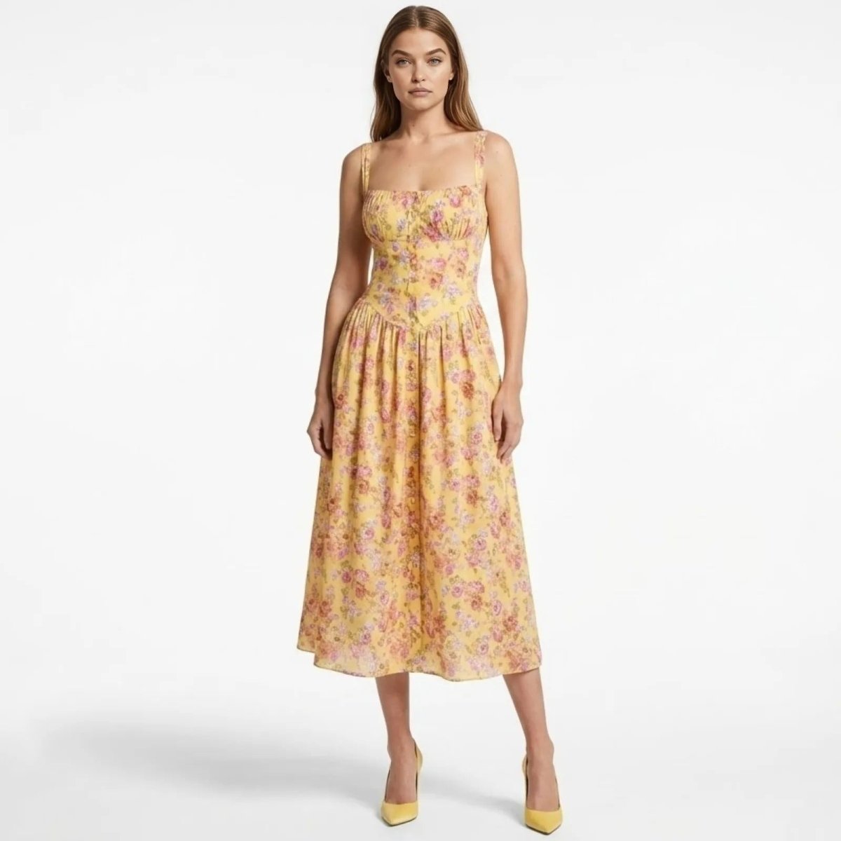 Model wearing the Kouvr Fashion Kallirroi yellow floral corset midi dress with a square neckline, front view on a white background.
