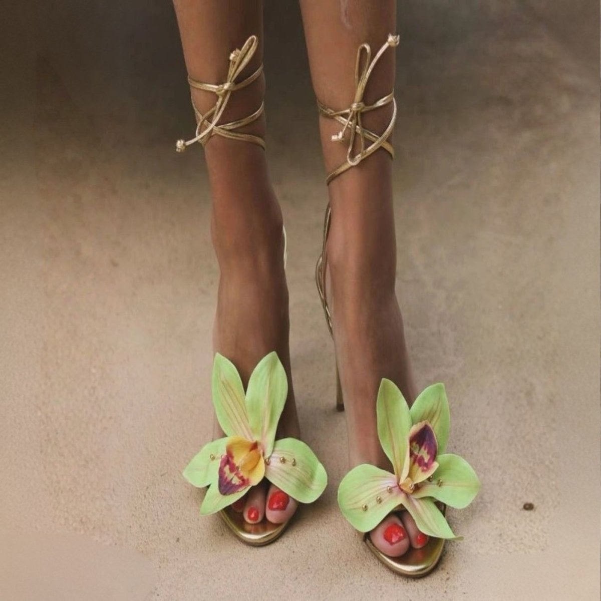 Green slip dress with thin straps on a white background