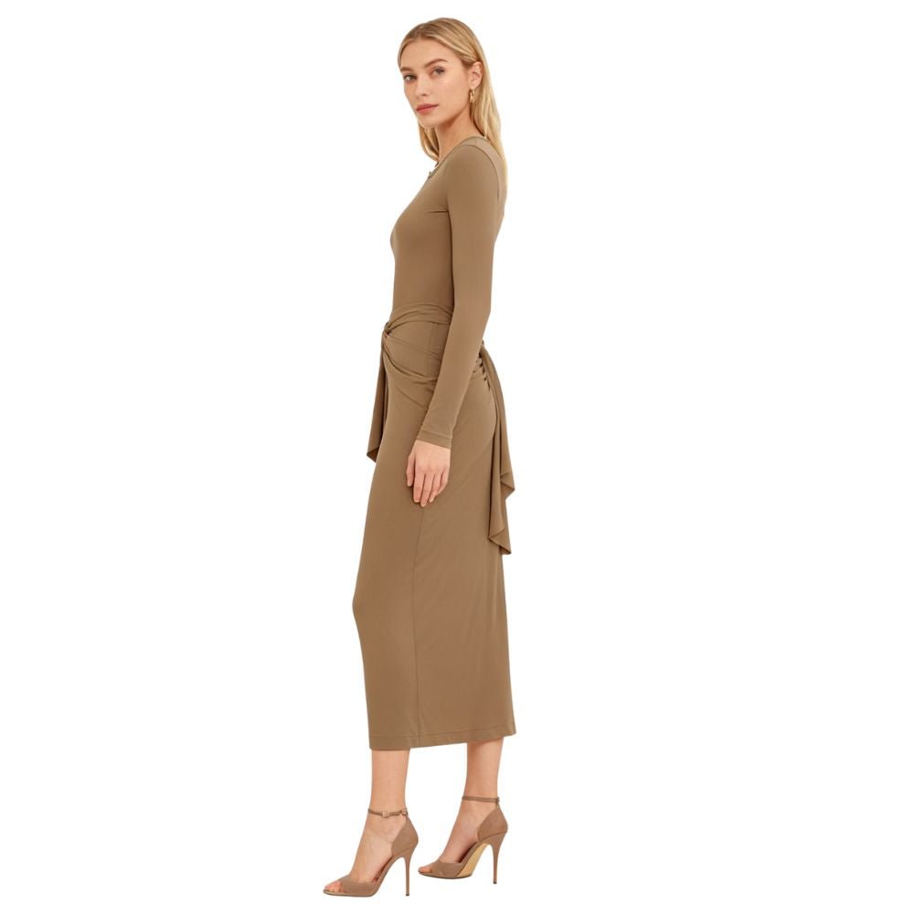 Woman wearing a khaki kouvr dress on a white background