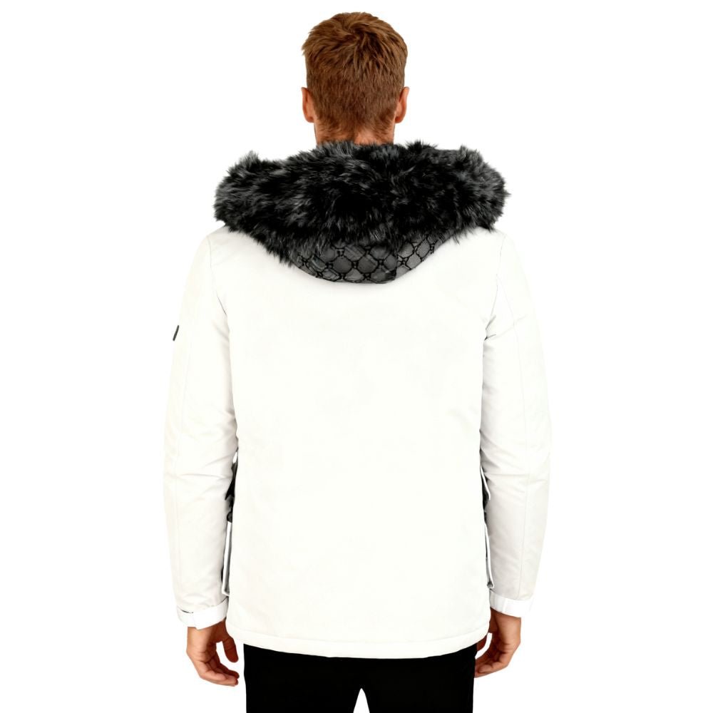 Person wearing a white jacket with a black fur hood on a white background