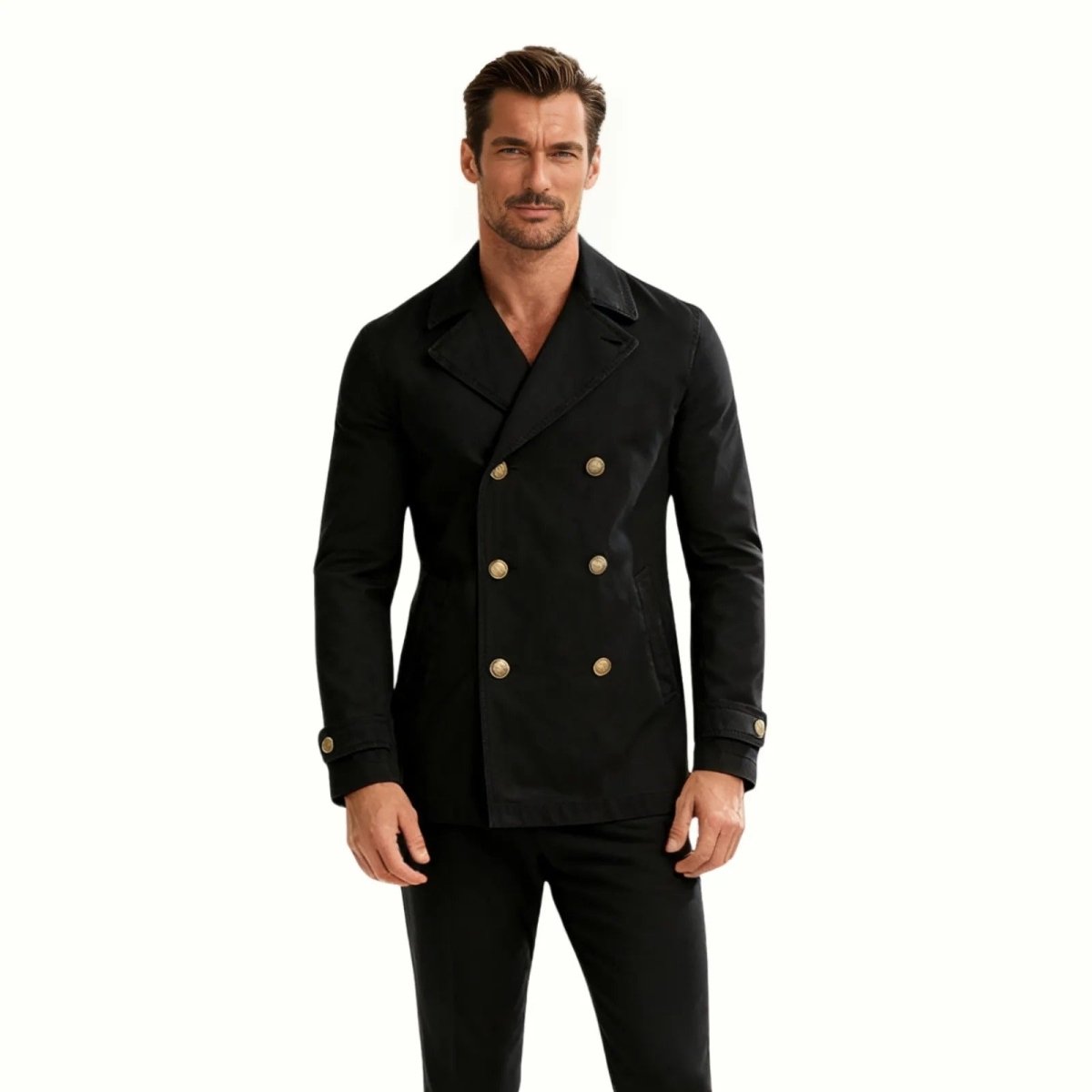 Man wearing the Kouvr Fashion black double-breasted cotton pea coat with gold buttons, showing the full front view and slim fit. 