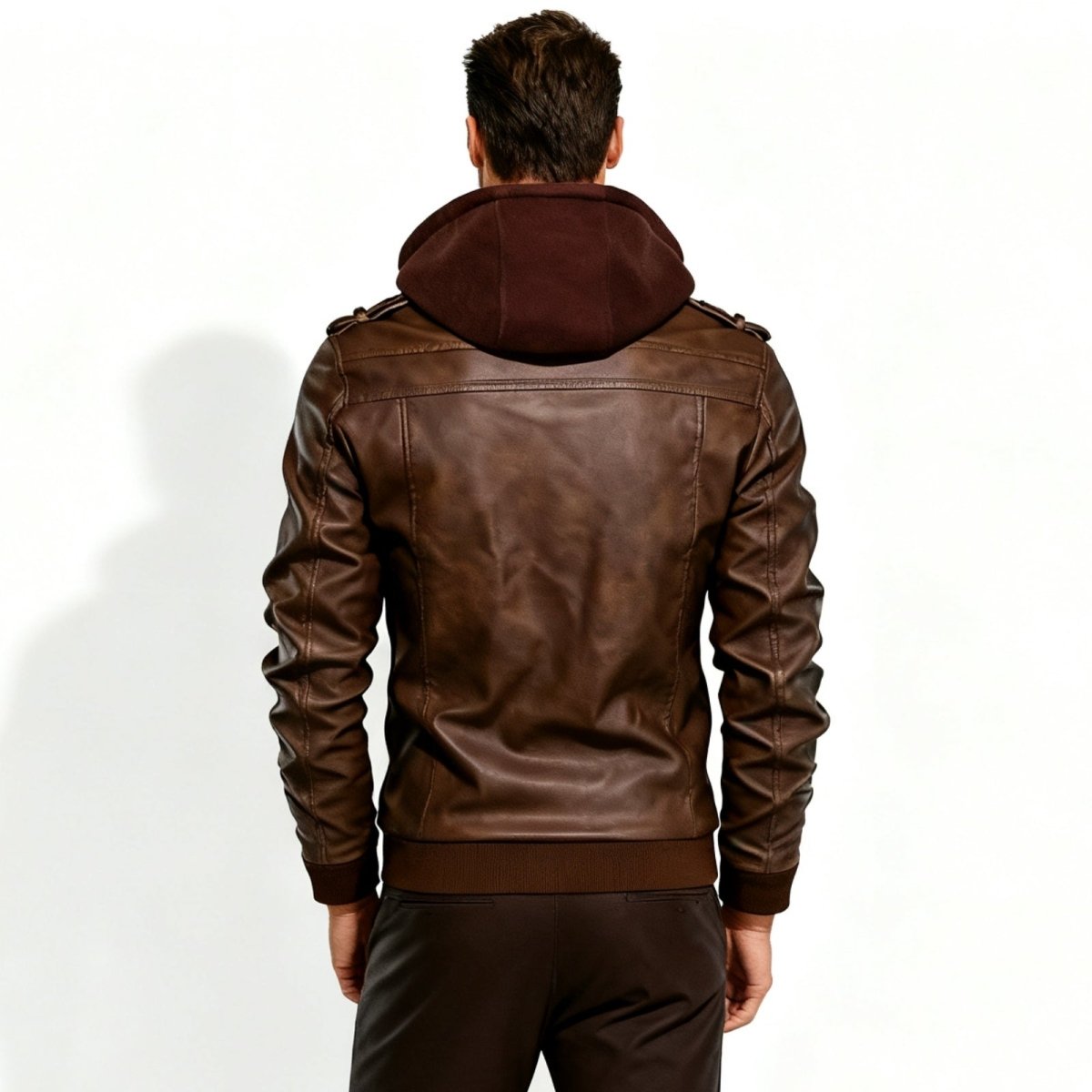 Back view of the men's brown leather jacket with a contrasting fleece hood by Kouvr Fashion.