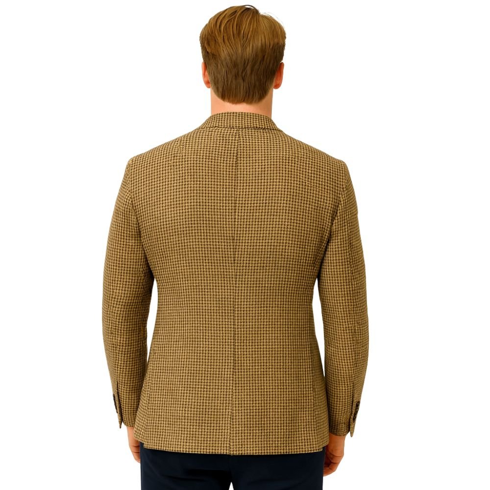 Model wearing Kouvr Fashion brown and black houndstooth blazer with black trousers