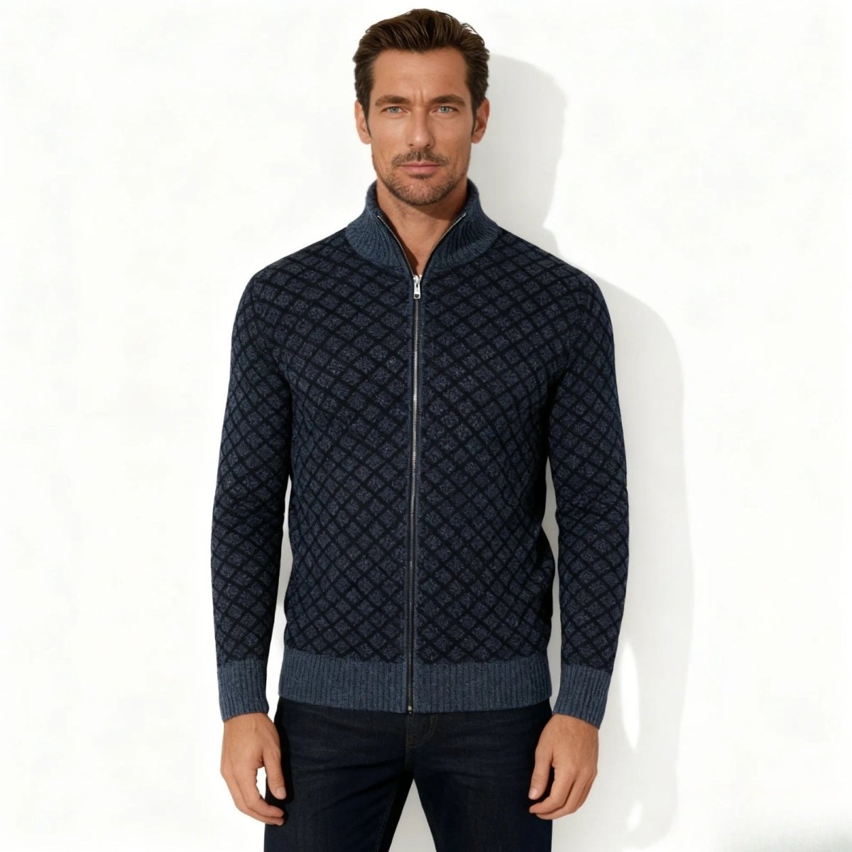 Model wearing the Kouvr Fashion men's navy blue diamond knit full-zip mock neck cardigan sweater with dark jeans.
