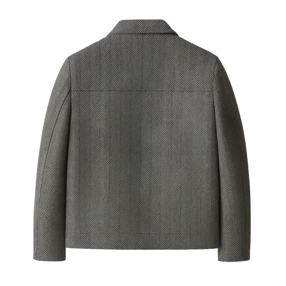 Man wearing Kouvr Fashion gray herringbone wool car coat over a white turtleneck