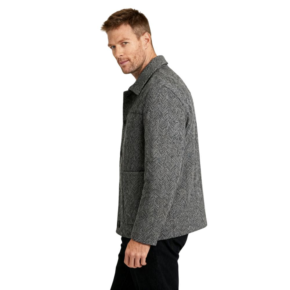 Man wearing a gray kouvr textured jacket on a white background