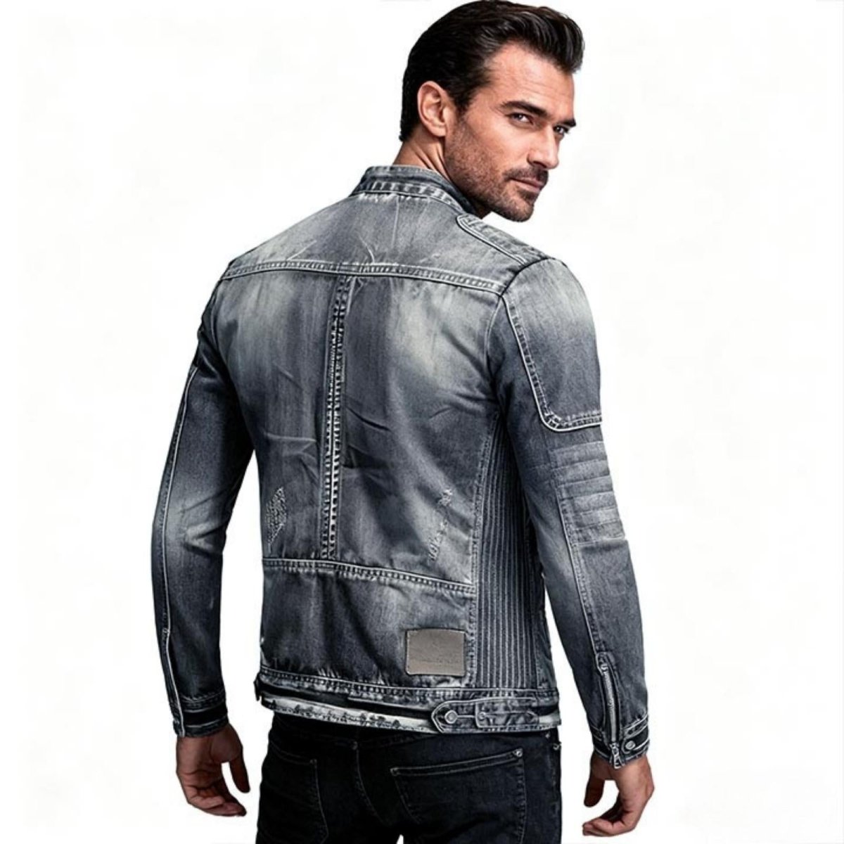 Man wearing a grayish blue Kouvr denim jacket on a white background
