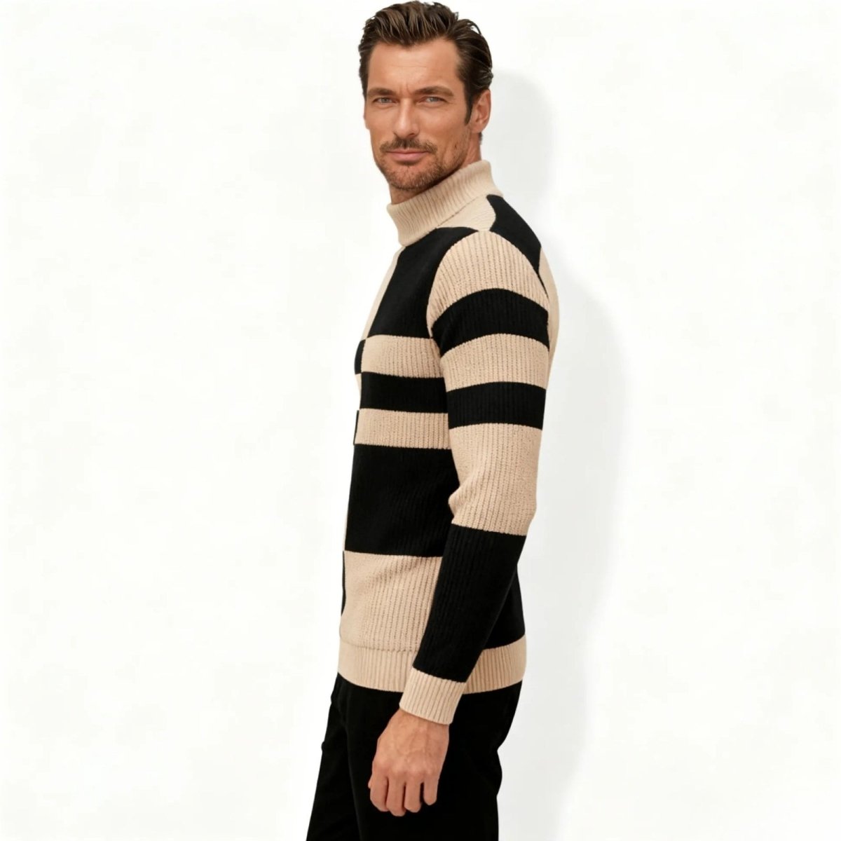 Side profile of a man in a slim fit beige and black striped ribbed knit mock neck jumper by Kouvr Fashion.

