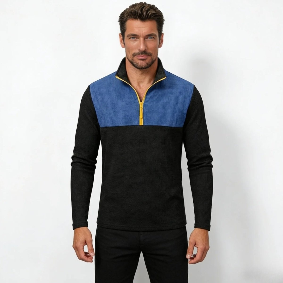  Model wearing the Kouvr Fashion men's blue and black color block quarter-zip pullover, front view.
