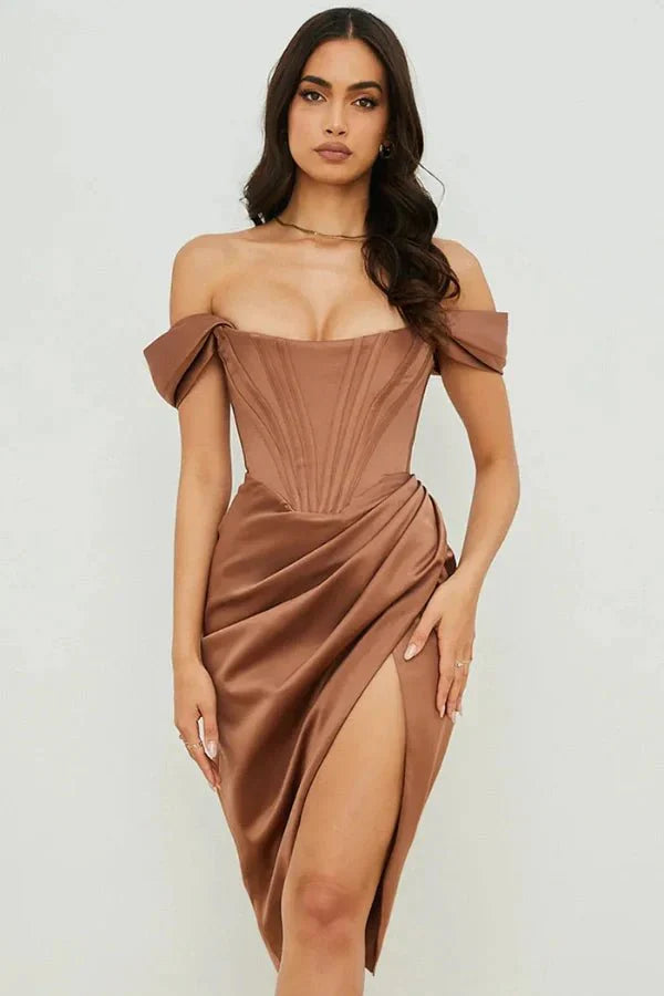 Model wearing Kouvr Fashion mocha brown off-the-shoulder satin corset dress with draped skirt and thigh slit