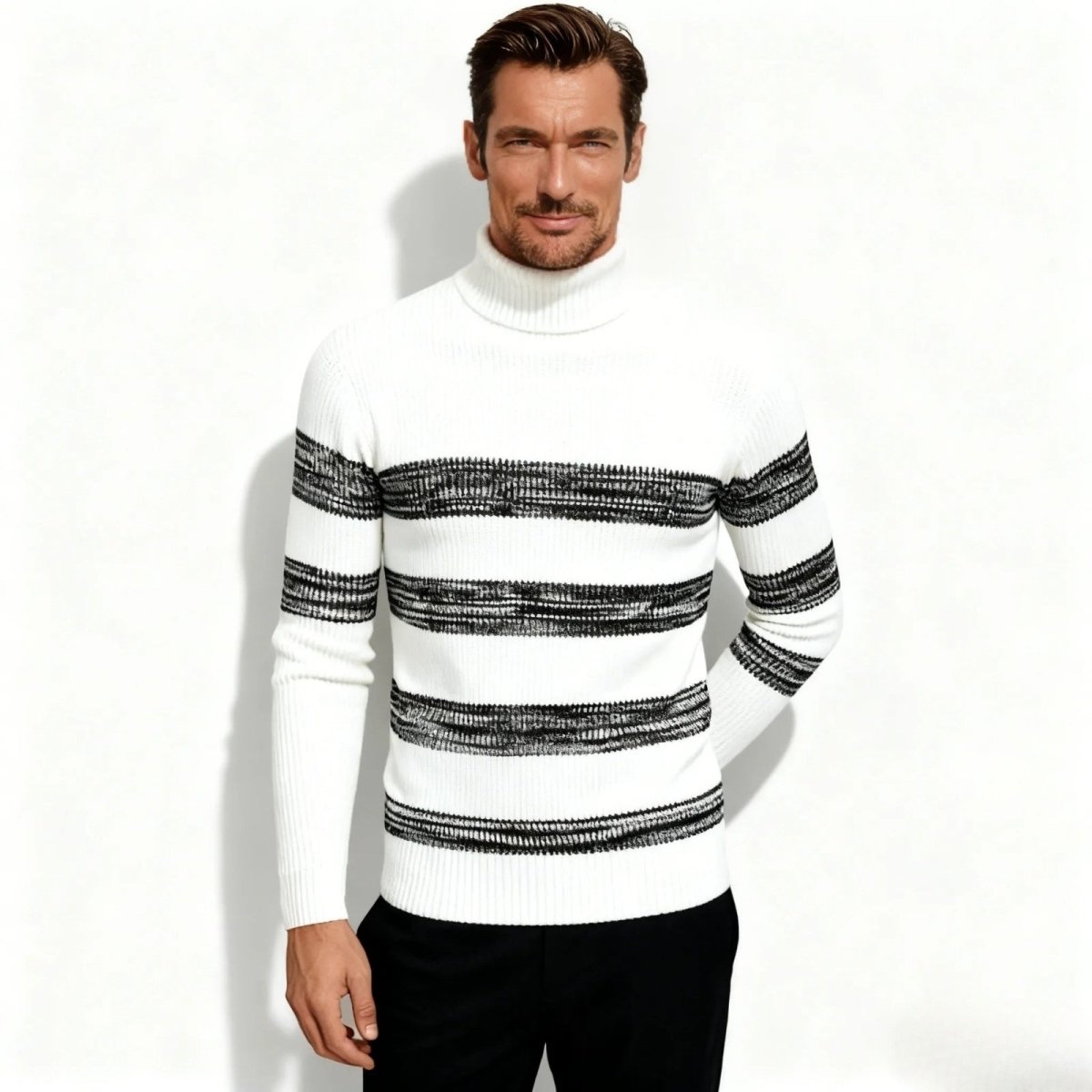 Model wearing the Kouvr Fashion Nerthus men's slim fit turtleneck sweater in white with textured black horizontal stripes, viewed from the front.

