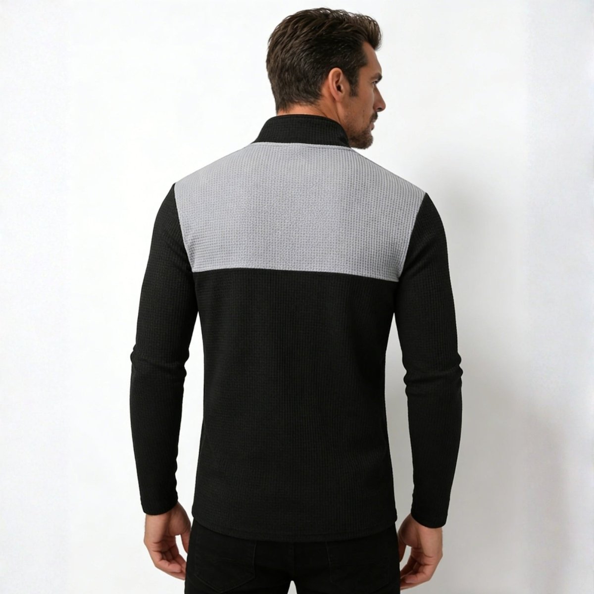 Back view of the Kouvr Fashion Ozzy men's designer mock neck sweater, showing the full black and grey color block panel design.
