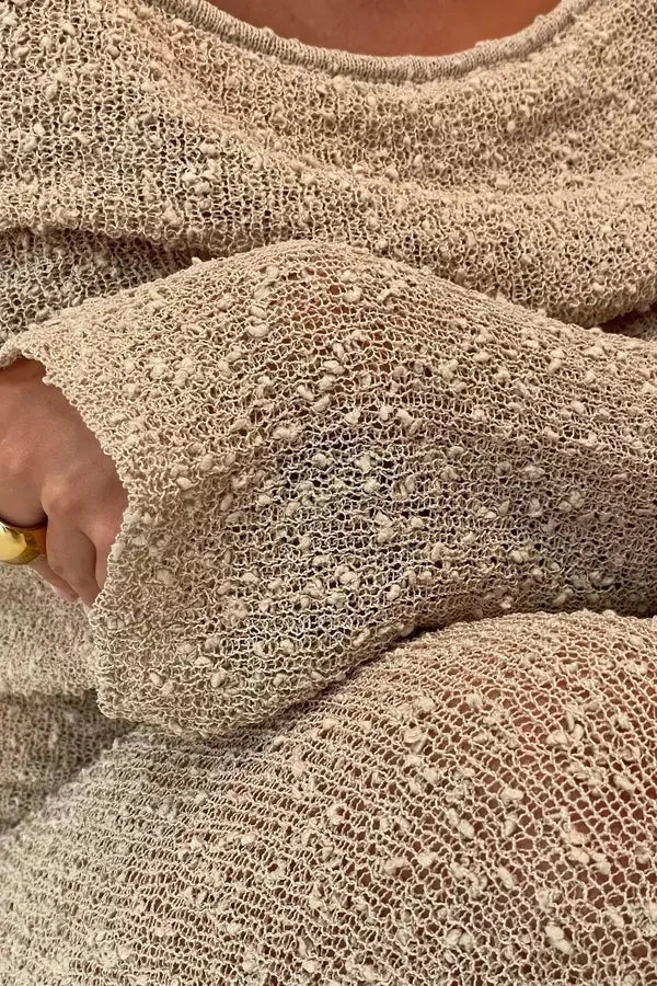 Model wearing the Kouvr Selah off-shoulder knit maxi dress in beige sand