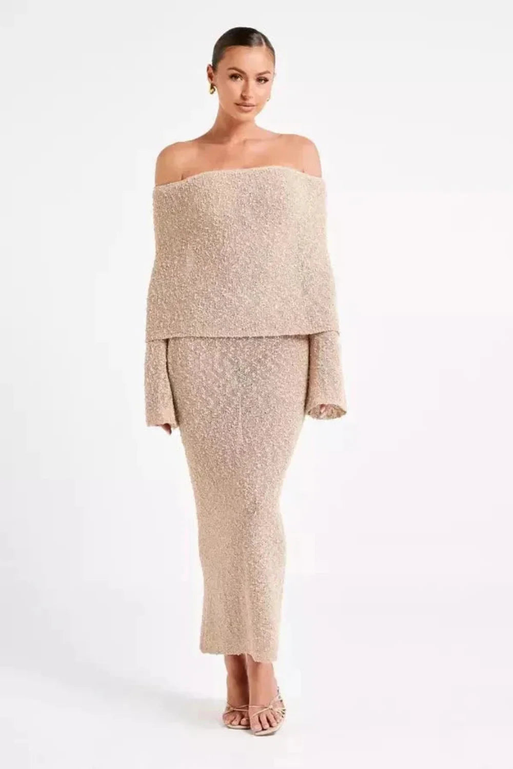 Model wearing the Kouvr Selah off-shoulder knit maxi dress in beige sand