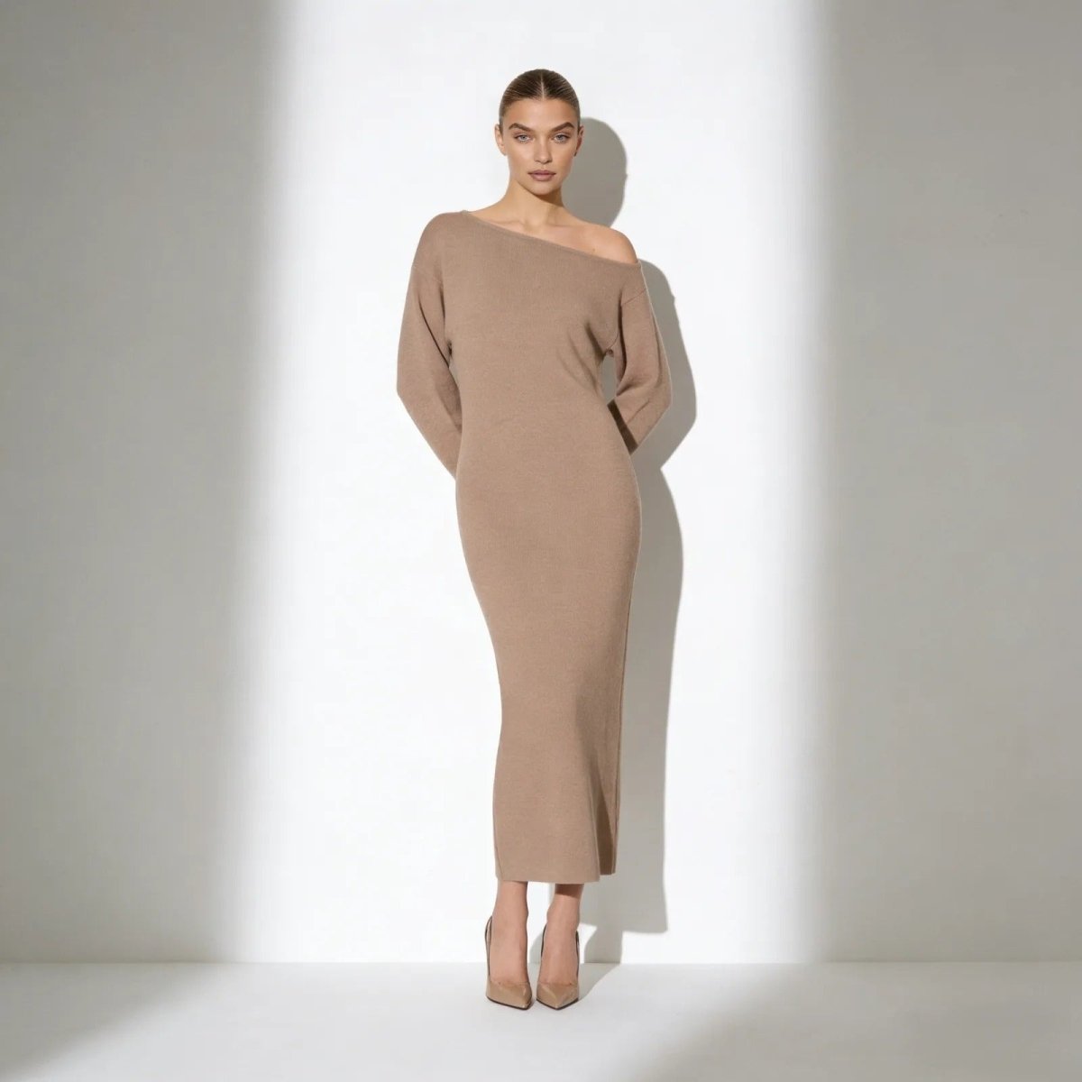 Model wearing the Kouvr Fashion Selena one-shoulder long sleeve knit midi dress in camel, front view.