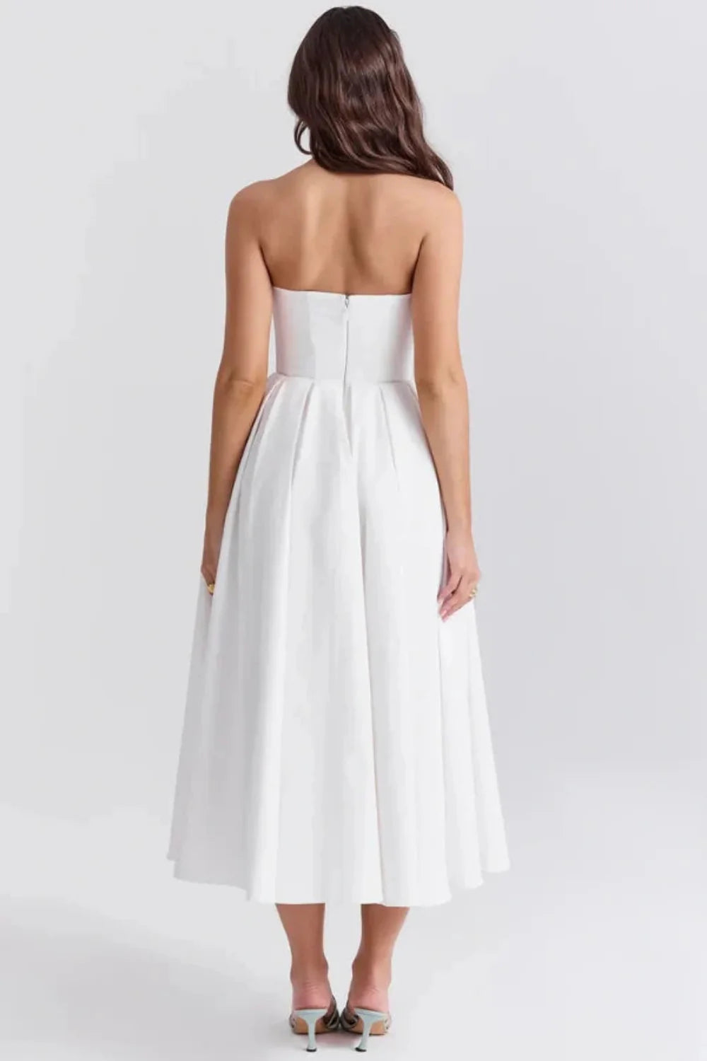 Kouvr Fashion white strapless midi dress with pleated A-line skirt shown on model