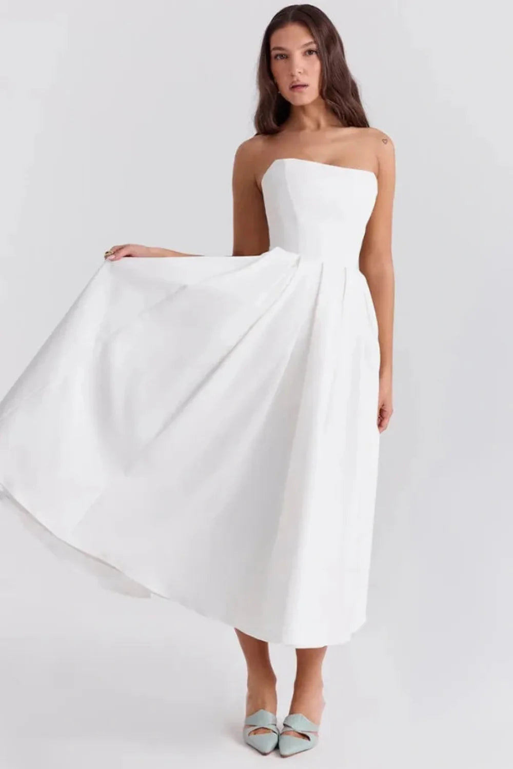 Kouvr Fashion white strapless midi dress with pleated A-line skirt shown on model