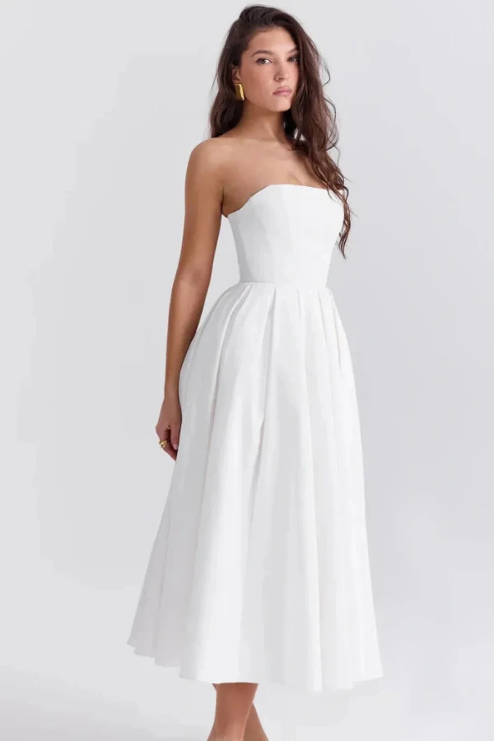 Kouvr Fashion white strapless midi dress with pleated A-line skirt shown on model
