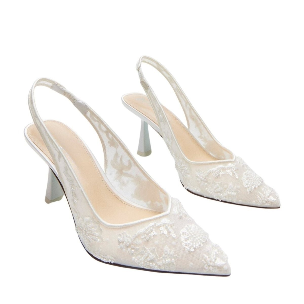 Pair of white lace high-heeled shoes on a white background