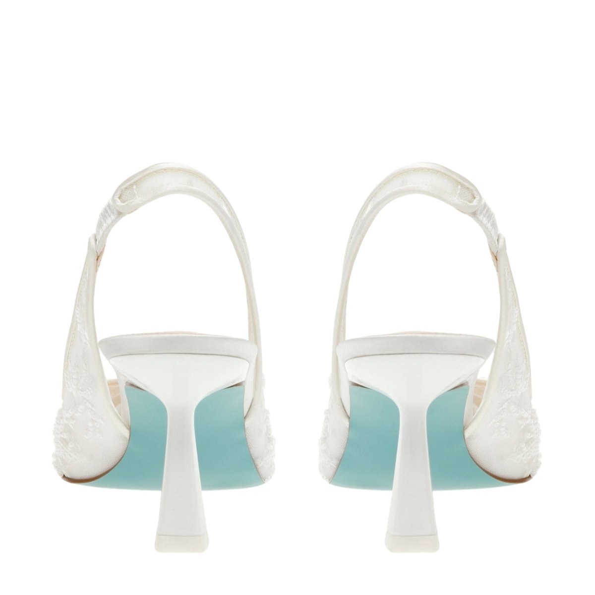 Pair of white Kouvr high-heeled shoes with light blue soles on a white background