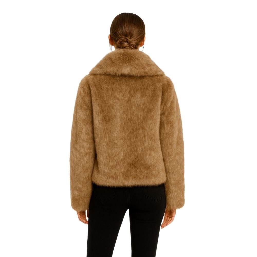 cruelty-free outerwear," "plush texture," "statement coat," "fall/winter essential," and "investment piece