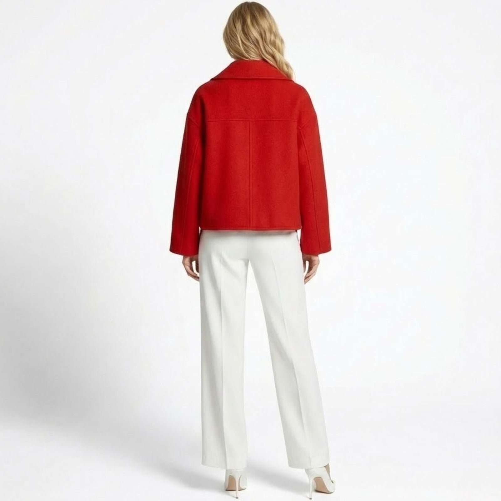 Back view of the Kouvr Fashion Katherine red wool jacket, highlighting the clean lines and modern, slightly oversized fit.
