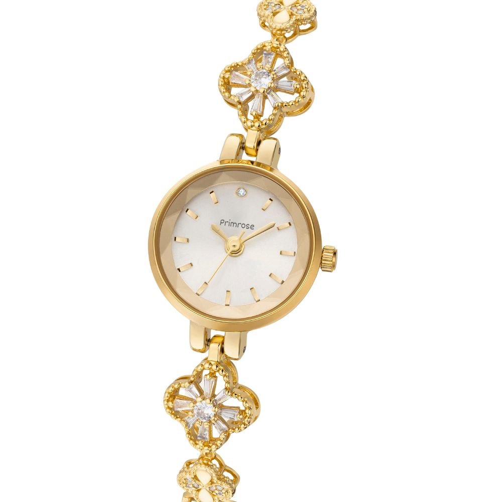 Gold Kouvr watch with floral design on a white background
