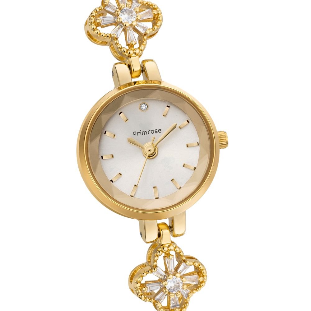 Gold Kouvr watch with floral designs on a white background