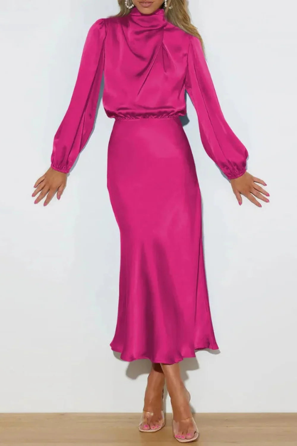 Back view of the Kouvr fuchsia satin midi dress showing the draped back and A-line skirt