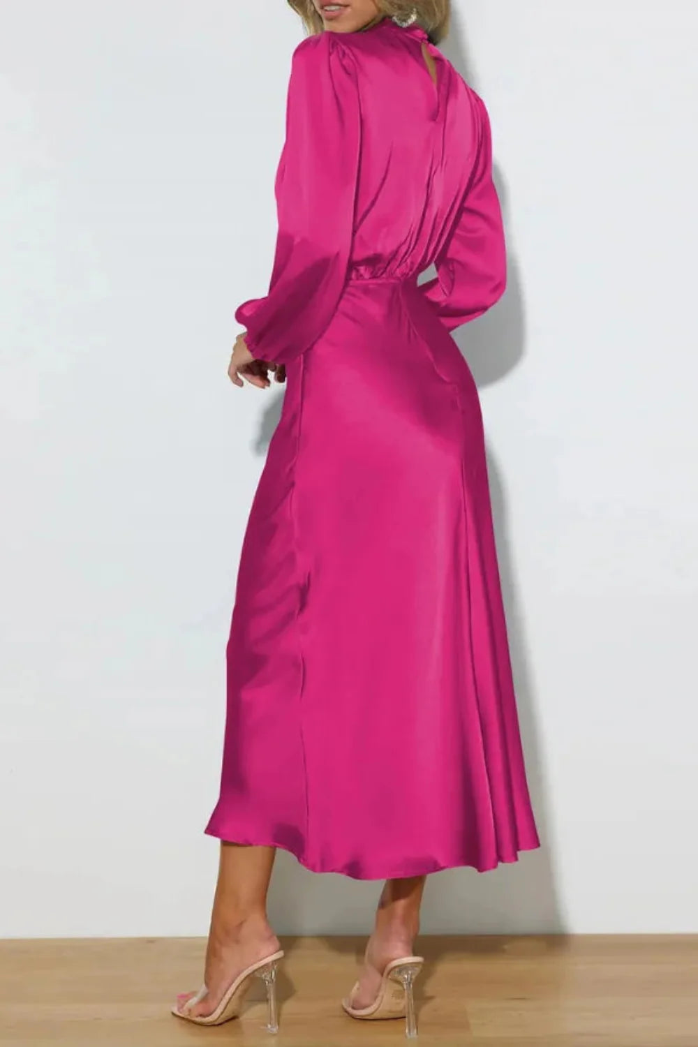 Back view of the Kouvr fuchsia satin midi dress showing the draped back and A-line skirt