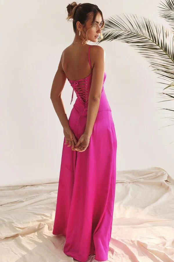Model wearing the Kouvr Gabriella Gown in Fuchsia Satin with a lace-up corset back.
