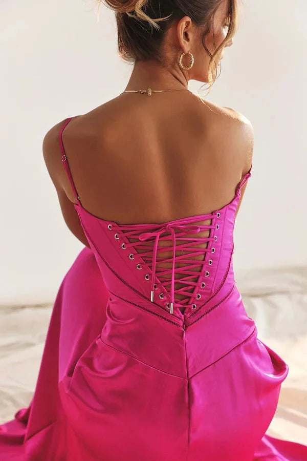 Model wearing the Kouvr Gabriella Gown in Fuchsia Satin with a lace-up corset back.