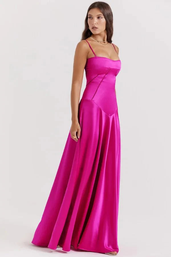 Model wearing the Kouvr Gabriella Gown in Fuchsia Satin with a lace-up corset back.