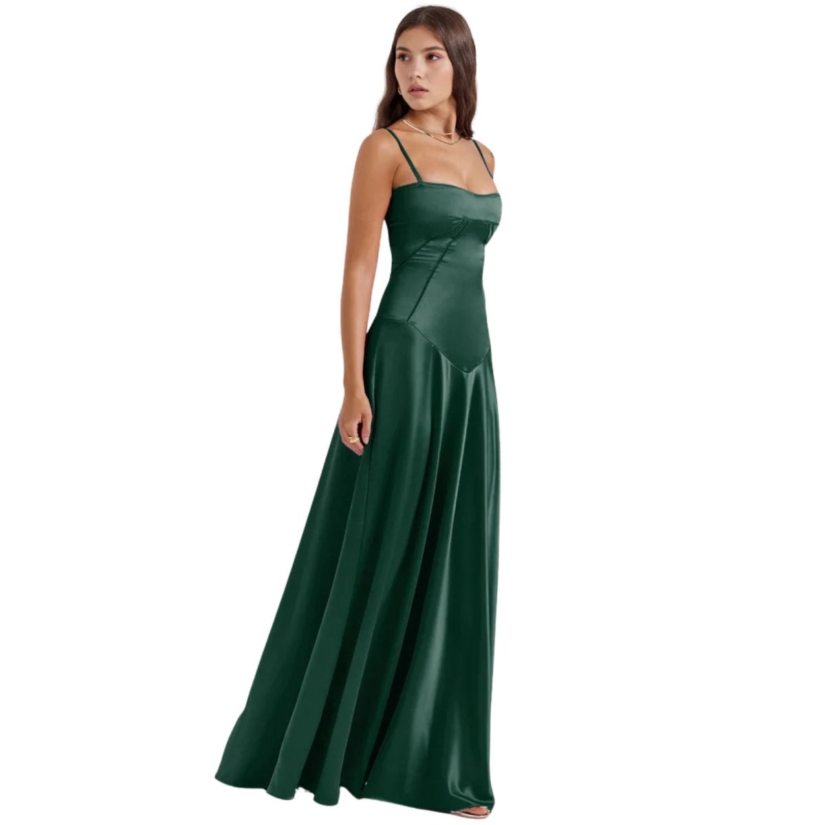 Woman wearing a green kouvr evening gown on a white background