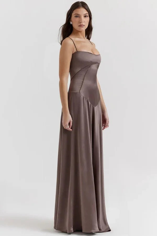 Kouvr Gabriella Gown in Mocha: a brown satin corset maxi dress with a lace-up back, worn by a model.