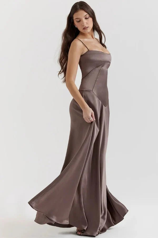 Kouvr Gabriella Gown in Mocha: a brown satin corset maxi dress with a lace-up back, worn by a model.