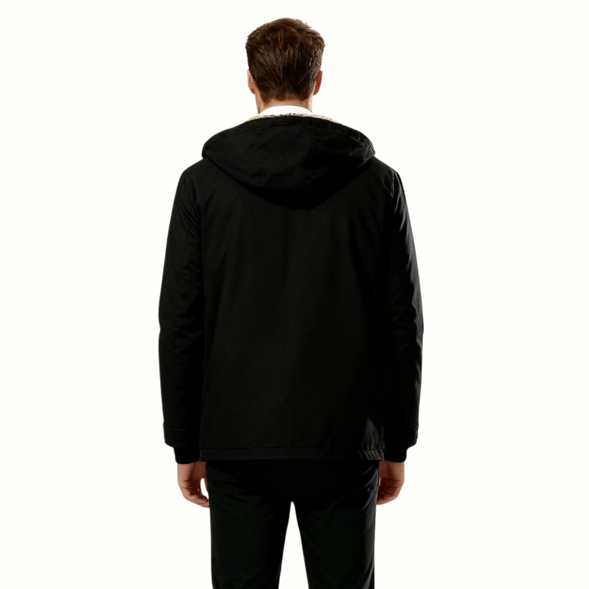 Back view of a man wearing the Kouvr Honovi heavyweight black winter coat with the hood up.