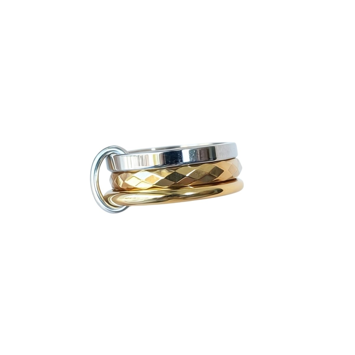Kouvr Interlocking Trio Ring with faceted gold and polished silver bands on a white background.