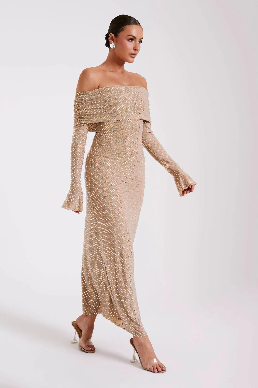 Model from behind in Kouvr Jada Beige off-the-shoulder formal gown with flare sleeves