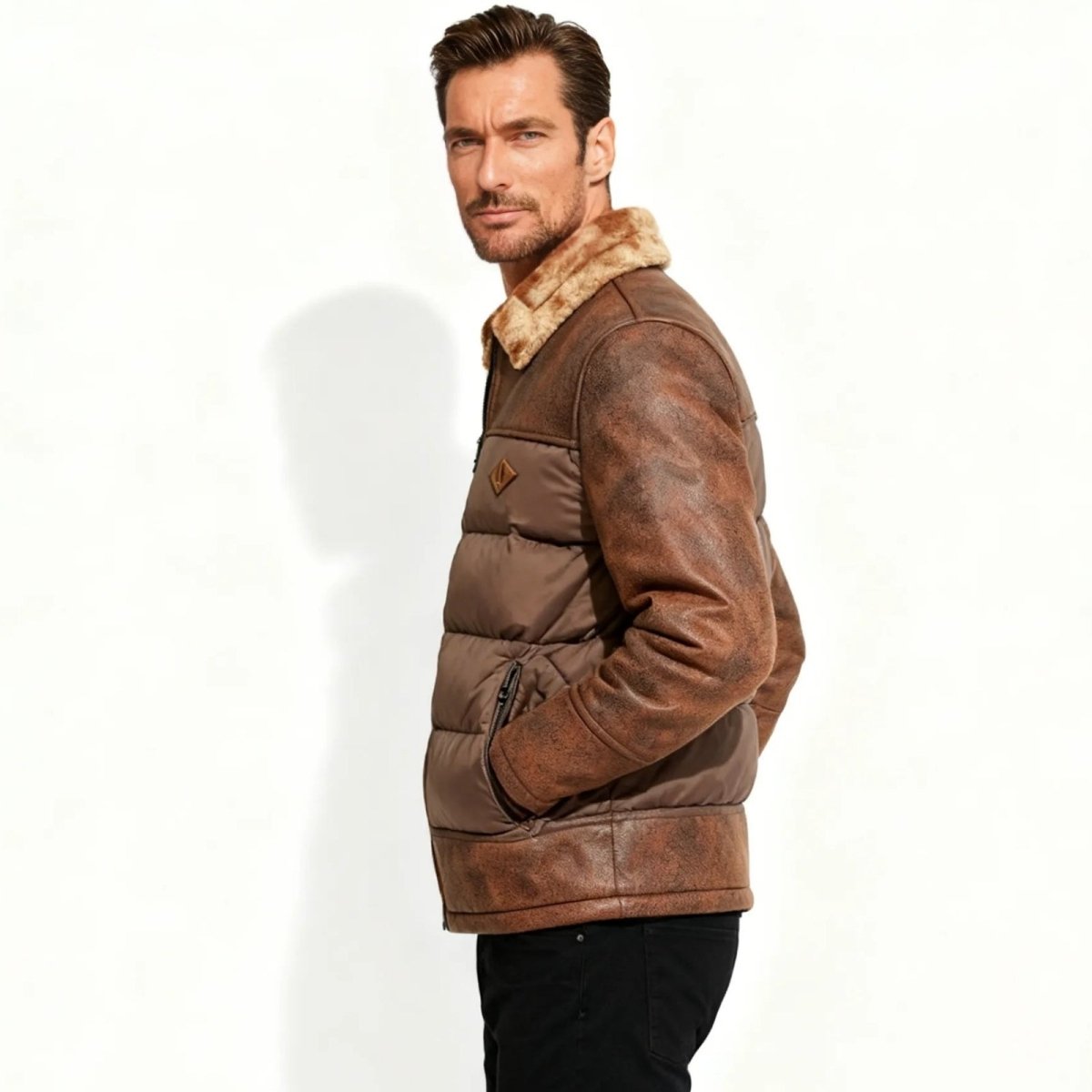 Man wearing a brown Kouvr leather jacket with fur lining on a white background