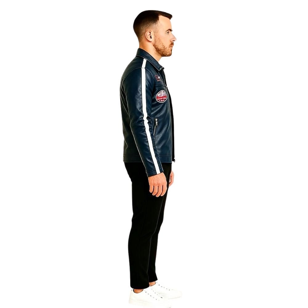 Man wearing a navy blue kouvr tracksuit with white stripes on a white background