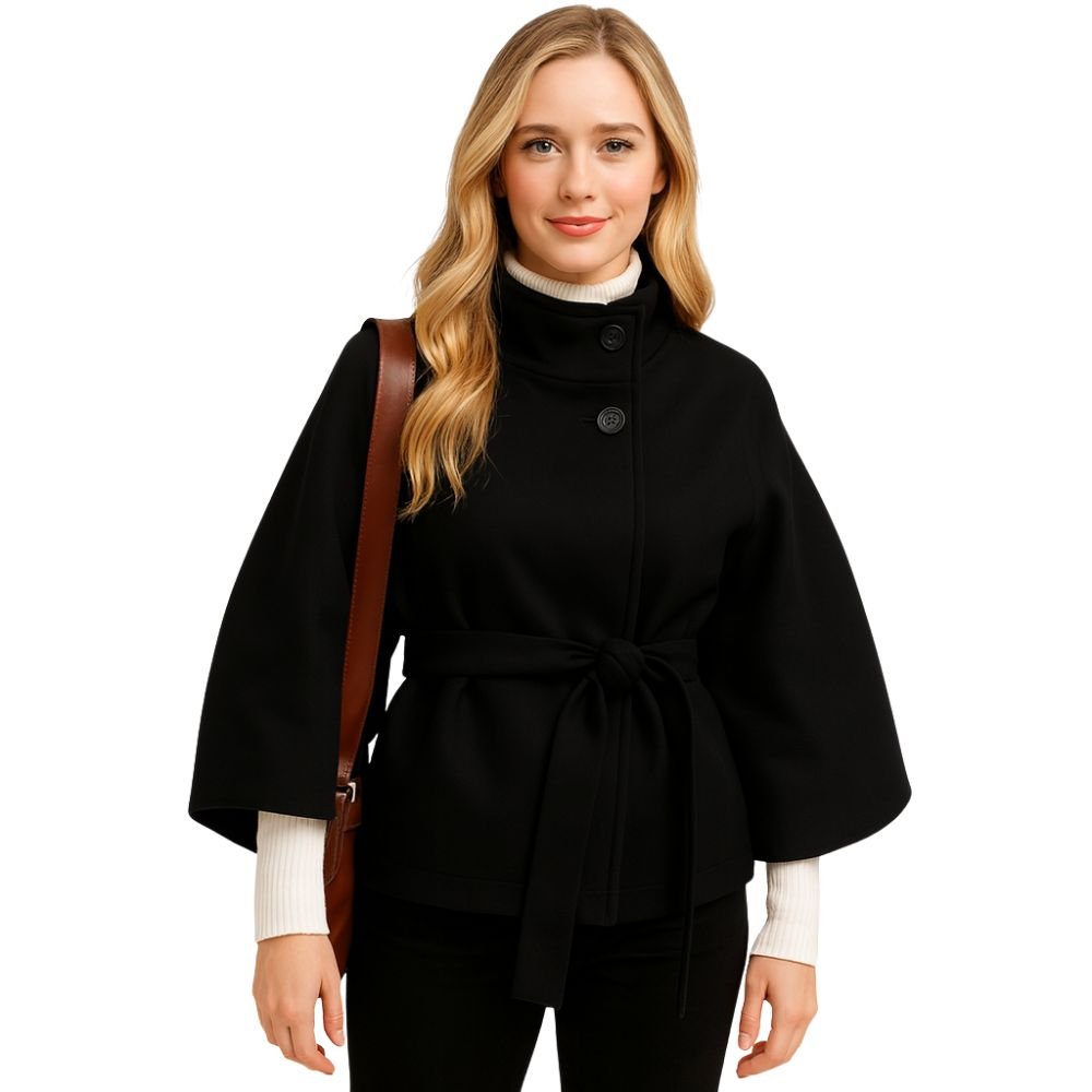 Model wearing the black Kouvr Jaye Cape Jacket, showcasing the tie-back belt and wide kimono sleeves