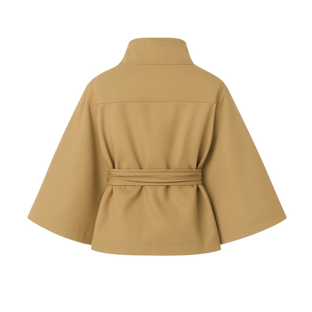 Model wearing Kouvr Fashion belted cape jacket with funnel neck and wide kimono sleeves