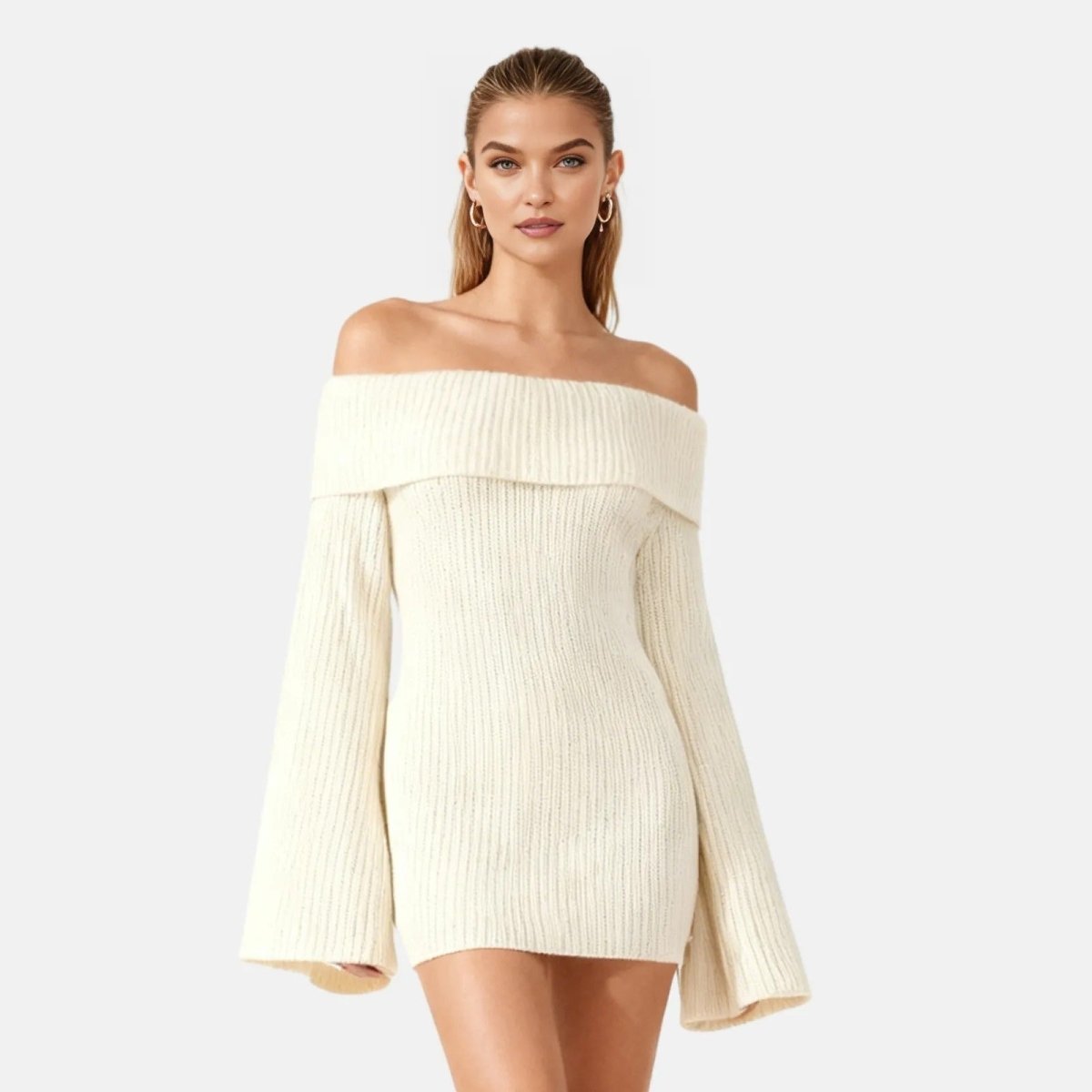 Woman wearing a ivory off-shoulder dress on a white background