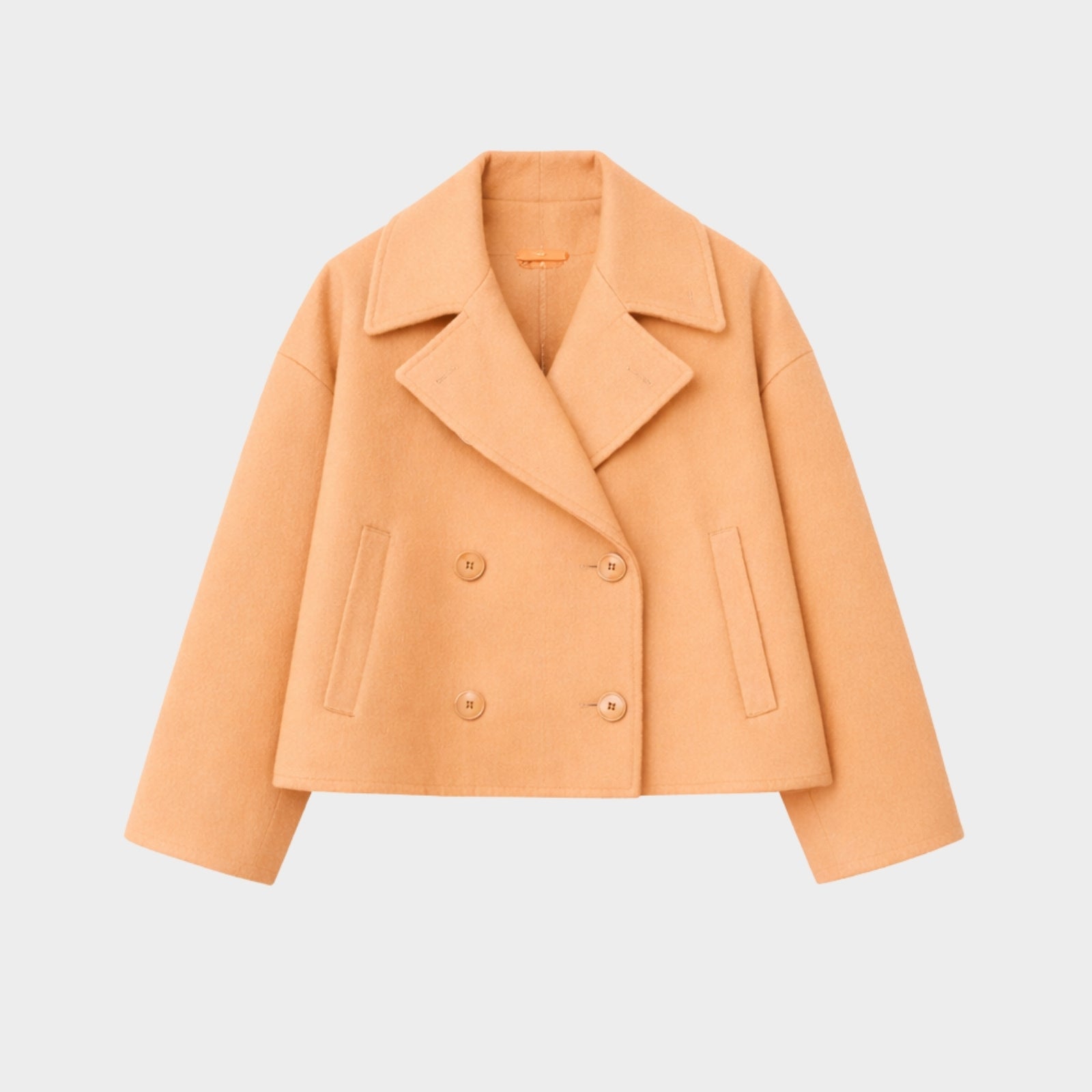 Detail shot of the back and central seam work on the Kouvr Katherine cropped wool jacket, showing the quality of the tailoring.