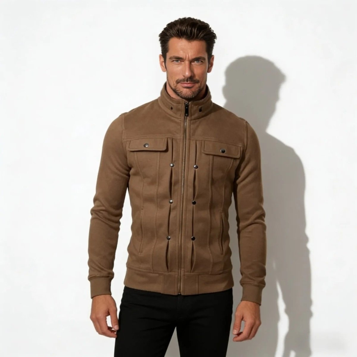 Male model wearing the Kouvr Kent men's luxury field jacket in brown, zipped up, paired with black trousers.