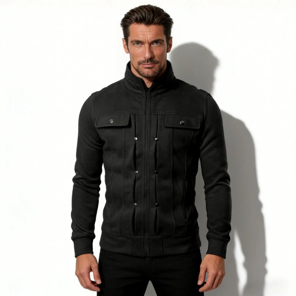 Man wearing the Kouvr Kent slim fit black military knit jacket with a stand collar and chest pockets, viewed from the front against a white background.