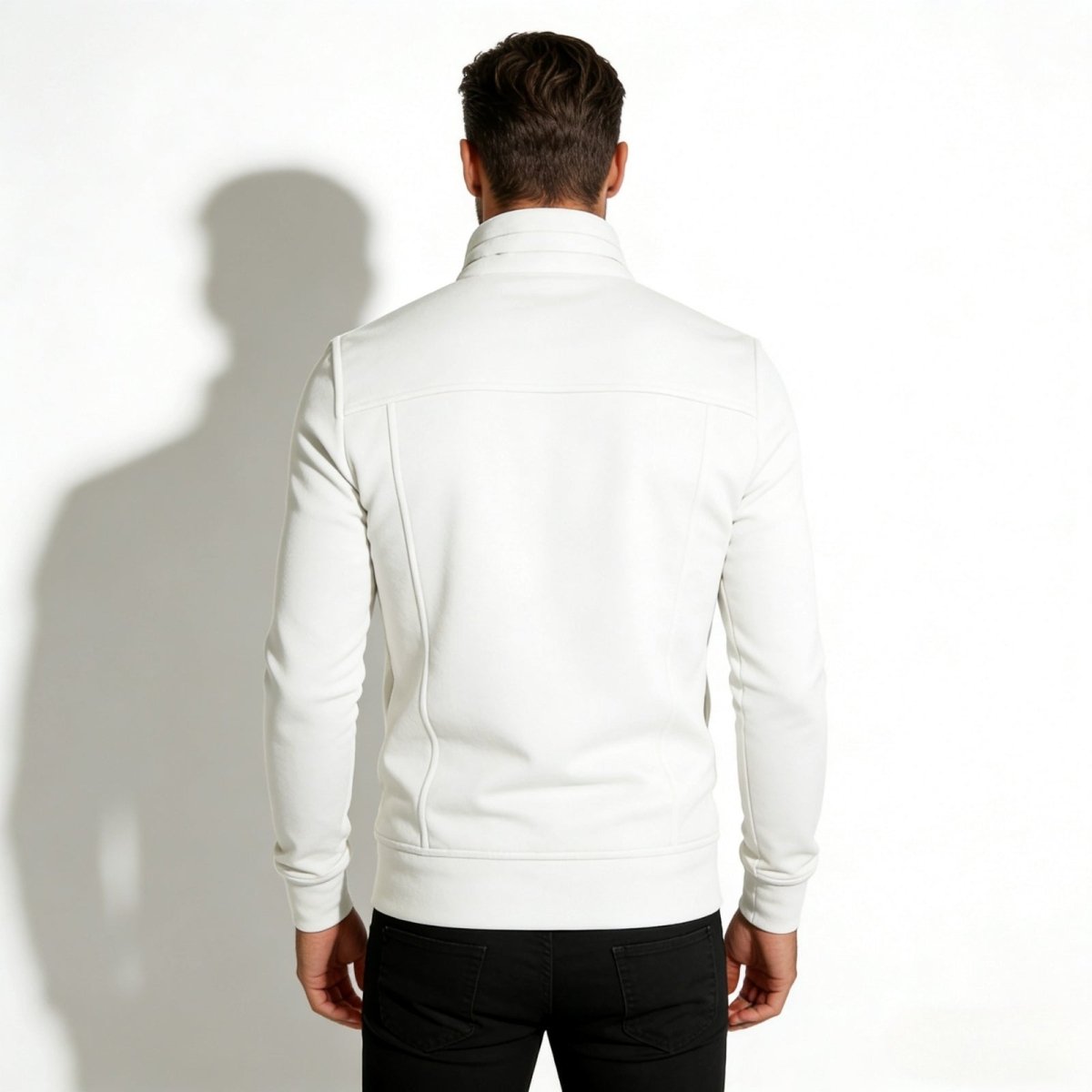 Back view of the Kouvr Kent men's white jacket, highlighting the clean lines, yoke seam, and ribbed hem.