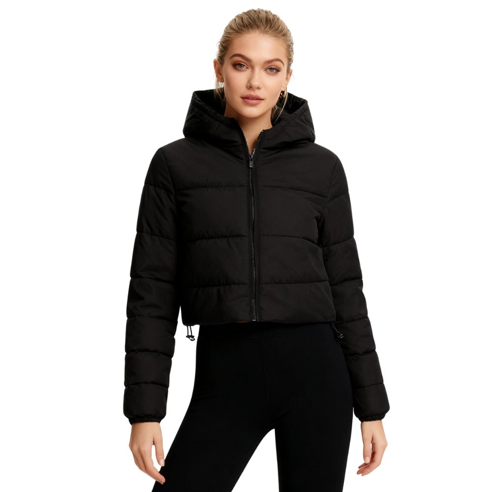 Woman wearing a black Kouvr puffer jacket on a white background