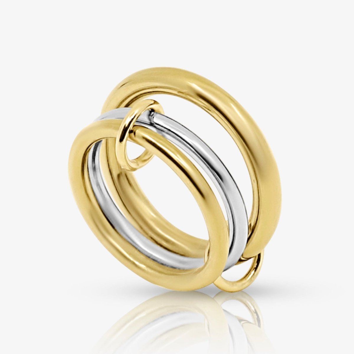 Studio product shot of the Kouvr Mavis two-tone interlocking ring with two gold bands and one silver band.